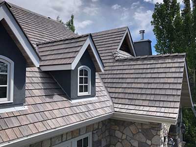 Close up of a residential roof with light gray DaVinci tiles